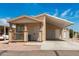 Tan manufactured home with carport and small porch at 11596 W Sierra Dawn Blvd # 5, Surprise, AZ 85378