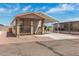 Tan manufactured home with carport and small porch at 11596 W Sierra Dawn Blvd # 5, Surprise, AZ 85378