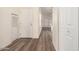 Light-colored hallway with wood-look flooring and doors at 11596 W Sierra Dawn Blvd # 5, Surprise, AZ 85378