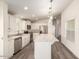 Modern kitchen featuring white cabinets, stainless steel appliances, and an island at 11596 W Sierra Dawn Blvd # 5, Surprise, AZ 85378