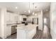 Modern kitchen featuring white cabinets, stainless steel appliances, and an island at 11596 W Sierra Dawn Blvd # 5, Surprise, AZ 85378