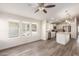 Bright living room with ceiling fan and laminate wood floors at 11596 W Sierra Dawn Blvd # 5, Surprise, AZ 85378
