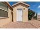 Tan colored shed with a white door, located in a gravel area at 11596 W Sierra Dawn Blvd # 5, Surprise, AZ 85378