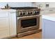 Kitchen detail of stainless steel range and oven at 1410 E Blue Ridge Ct, Phoenix, AZ 85086