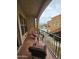 Relaxing balcony featuring comfortable seating and a view of the community pool at 14575 W Mountain View Blvd # 11210, Surprise, AZ 85374