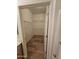 Spacious walk-in closet with shelving in a naturally lit bathroom at 14575 W Mountain View Blvd # 11210, Surprise, AZ 85374
