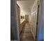 Well-lit bathroom showcasing dual sinks, modern fixtures, and walk-in closet at 14575 W Mountain View Blvd # 11210, Surprise, AZ 85374