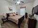 Inviting bedroom featuring classic furniture, soft lighting, and neutral decor at 14575 W Mountain View Blvd # 11210, Surprise, AZ 85374
