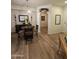 Elegant dining area with modern decor and arched doorway at 14575 W Mountain View Blvd # 11210, Surprise, AZ 85374