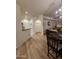 Dining room showcasing light wood floors, chandelier, seamlessly connecting to the living area at 14575 W Mountain View Blvd # 11210, Surprise, AZ 85374