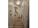 Hallway with hard wood flooring, leading to the kitchen and bathroom at 14575 W Mountain View Blvd # 11210, Surprise, AZ 85374