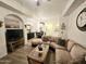 Inviting living room features a plush sectional sofa, modern decor, and an open layout for easy entertaining at 14575 W Mountain View Blvd # 11210, Surprise, AZ 85374