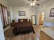Comfortable bedroom with ensuite bathroom and decorative accents at 14575 W Mountain View Blvd # 11210, Surprise, AZ 85374
