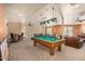 Community recreation room with pool table and seating at 14575 W Mountain View Blvd # 11210, Surprise, AZ 85374