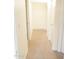 Hallway with neutral colored carpet and doors to rooms at 1500 W Rio Salado Pkwy # 74, Mesa, AZ 85201