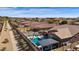 Aerial view of a well-maintained backyard featuring a sparkling pool, cabana, and manicured landscaping at 15114 W Turney Ave, Goodyear, AZ 85395