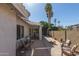 Enjoy outdoor living with a covered patio, lounge chairs, and a well-kept garden at 1582 W Chicago St, Chandler, AZ 85224