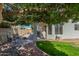 Backyard view with shaded patio area, lush greenery, and a well-maintained lawn at 1582 W Chicago St, Chandler, AZ 85224
