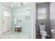 Modern bathroom features a glass shower door, white tile, dual shower heads and a wooden bench at 1582 W Chicago St, Chandler, AZ 85224