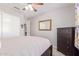 Bedroom features a closet, dresser, ceiling fan, and neutral walls at 1582 W Chicago St, Chandler, AZ 85224