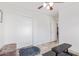 Minimalist bedroom with closet, neutral walls, tile flooring, and a ceiling fan at 1582 W Chicago St, Chandler, AZ 85224