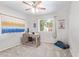Bedroom with wood desk and ceiling fan offers a comfortable and functional workspace at 1582 W Chicago St, Chandler, AZ 85224