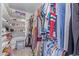 Spacious walk-in closet provides plenty of room for clothing, shoes, and storage boxes at 1582 W Chicago St, Chandler, AZ 85224
