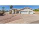 Charming single-story home featuring a three-car garage and well-maintained desert landscaping at 1582 W Chicago St, Chandler, AZ 85224