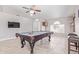 This game room has a pool table, dart board, wet bar and a nice ceiling fan at 1582 W Chicago St, Chandler, AZ 85224