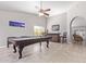 Spacious game room featuring a pool table, wet bar, ceiling fan, and tile flooring at 1582 W Chicago St, Chandler, AZ 85224
