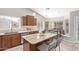 Open kitchen featuring granite countertops, wood cabinets, and a breakfast nook at 1582 W Chicago St, Chandler, AZ 85224