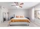 Comfortable bedroom with a ceiling fan, plush bedding, and lots of natural light at 1582 W Chicago St, Chandler, AZ 85224