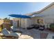 Charming patio featuring an outdoor lounge area, umbrella, and stylish patio furniture, perfect for outdoor relaxation and entertaining at 1582 W Chicago St, Chandler, AZ 85224