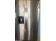Stainless steel refrigerator in the kitchen, featuring double doors, ice and water dispenser for convenience and modern appeal at 1582 W Chicago St, Chandler, AZ 85224