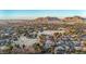 Overhead view of the neighborhood with mature landscaping and a golf course at 1708 W Harmont Dr, Phoenix, AZ 85021