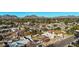 Neighborhood aerial showcases tree-lined streets and well-maintained homes with mountain views at 1708 W Harmont Dr, Phoenix, AZ 85021