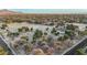 Neighborhood aerial view near a golf course, surrounded by mature trees at 1708 W Harmont Dr, Phoenix, AZ 85021