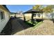 Beautiful backyard featuring a gazebo, decorative rock landscaping, and a paved walkway, perfect for outdoor entertaining at 1708 W Harmont Dr, Phoenix, AZ 85021