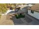 This backyard features a cozy gazebo, rock landscaping, and a seating area at 1708 W Harmont Dr, Phoenix, AZ 85021