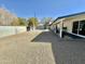 Expansive backyard featuring low-maintenance gravel and a covered patio area at 1708 W Harmont Dr, Phoenix, AZ 85021