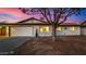 Charming home boasts a two-car garage and a well-maintained front yard at 1708 W Harmont Dr, Phoenix, AZ 85021