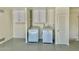 Garage area with new washer and dryer, and storage cabinets at 1708 W Harmont Dr, Phoenix, AZ 85021