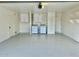 Spacious and clean garage featuring epoxy floors, laundry hookups, built-in cabinets and shelving, and ample storage space at 1708 W Harmont Dr, Phoenix, AZ 85021