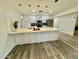 Spacious kitchen with a large island, stainless steel appliances, and sleek cabinetry at 1708 W Harmont Dr, Phoenix, AZ 85021