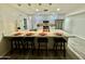 Bright kitchen featuring a large island with seating, pendant lights, and modern appliances, perfect for gatherings at 1708 W Harmont Dr, Phoenix, AZ 85021