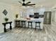 Open-concept kitchen with white cabinetry, stainless steel appliances, and island seating at 1708 W Harmont Dr, Phoenix, AZ 85021