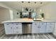 Spacious kitchen with a large island, stainless steel appliances, and sleek cabinetry at 1708 W Harmont Dr, Phoenix, AZ 85021