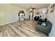 Spacious living room features neutral colors, wood-look flooring, and ample natural light at 1708 W Harmont Dr, Phoenix, AZ 85021
