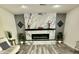 Beautiful living room featuring a fireplace, modern floors, and recessed lighting at 1708 W Harmont Dr, Phoenix, AZ 85021