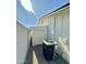 Exterior shot of a newly painted storage shed between home and backyard wall plus the A/C unit at 1708 W Harmont Dr, Phoenix, AZ 85021